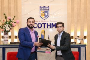 Zaheer Ahmad, Chief Operating Officer COTHM, and Ahsan Malik, Head of foodpanda HomeChefs Division exchanging files after signing the agreement